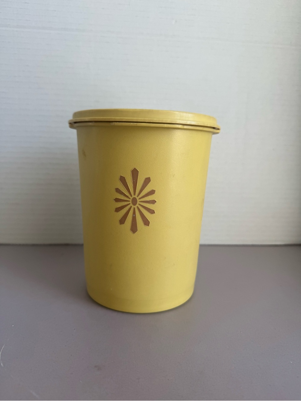 Tupperware Yellow Canister with Brown Sunburst Accent